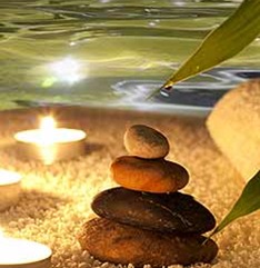 Hot stone spa treatment with candles